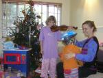 EOY 2005-015 - John and I asked Santa to deliver Carla a new violin so that she can start taking lessons from their neighbor. He