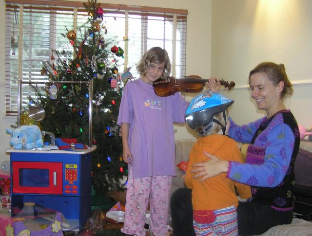 EOY 2005-015 - John and I asked Santa to deliver Carla a new violin so that she can start taking lessons from their neighbor. He