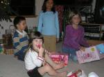 EOY 2005-019 - Opening presents at our house. Noah (4), Amaia (3), Maya (9), Carla (7).
