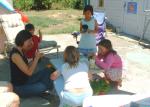 Michele helped the children with the flower pots.